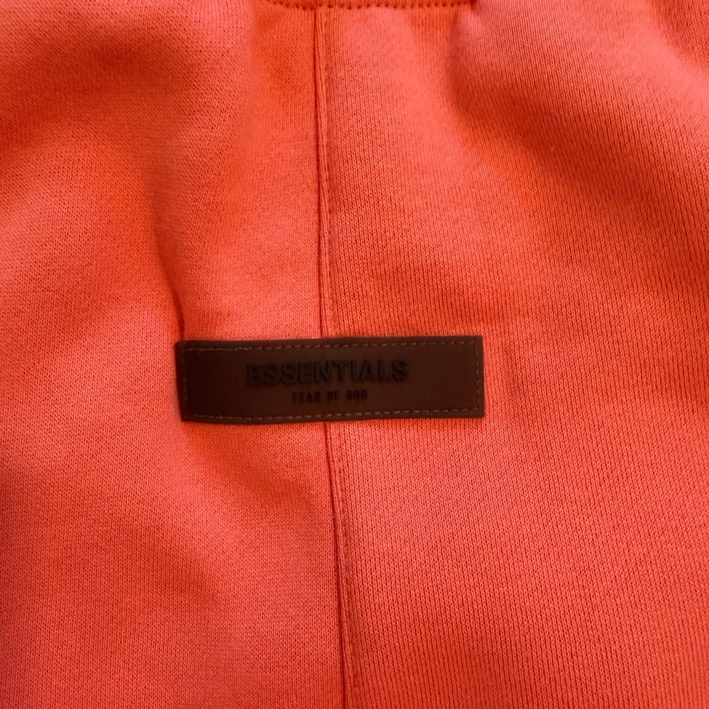 FEAR OF GOD ESSENTIALS - Tapered Logo Blend Jersey Sweatpants in Coral - Picture 9 of 11